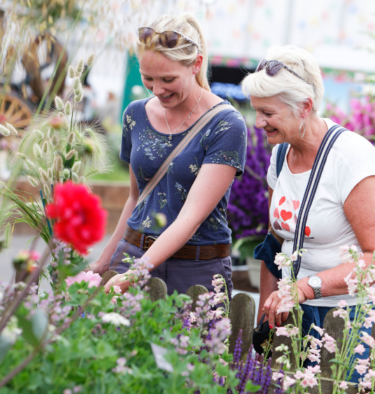 Two women admiring plants at BBC Gardeners' World Live