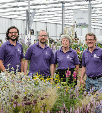 Barnsdale Gardens staff among flowers in advance of the 40th birthday celebrations at BBC Gardeners' World Live